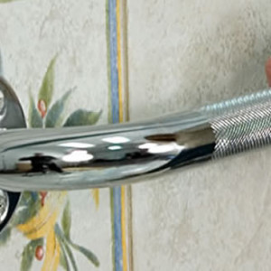 Knurled Chrome Grab Bar, by AquaSense®, on bathroom wall